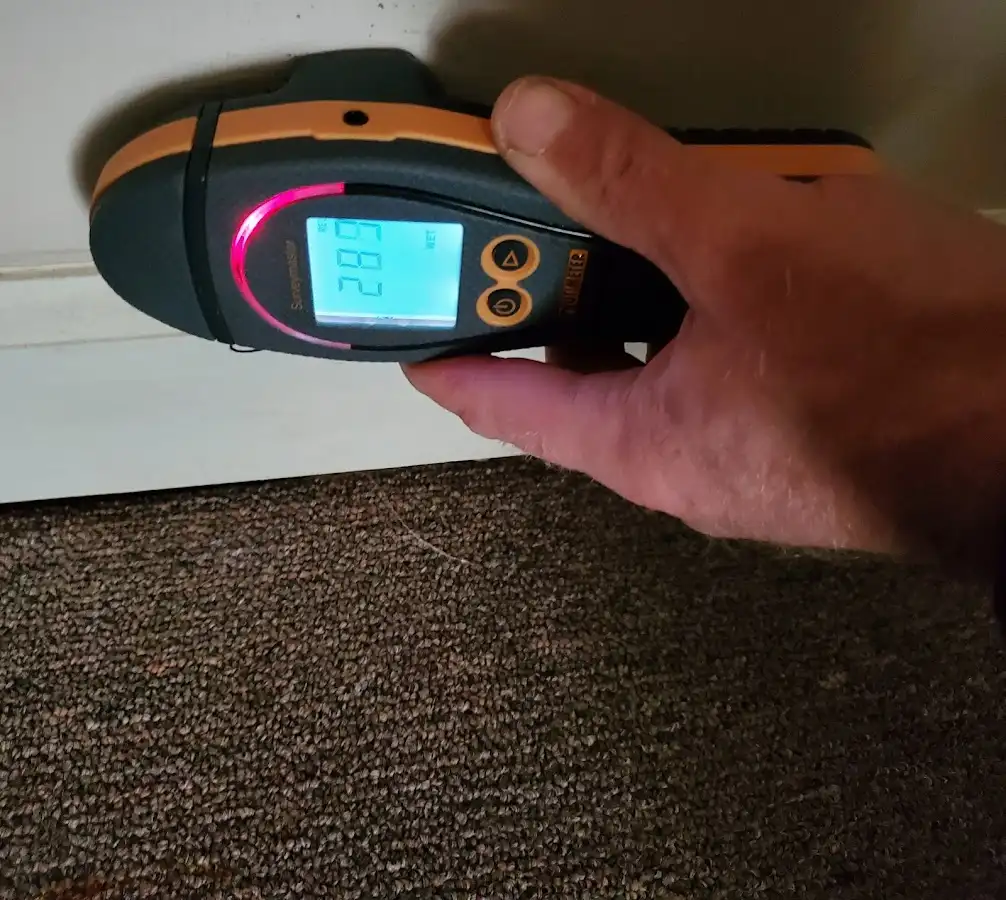 Moisture detection at baseboard during Storm Damage Restoration in Lackawanna